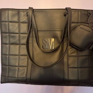 Large Steve Madden black shoulder bag with plenty of pockets and a change clutch